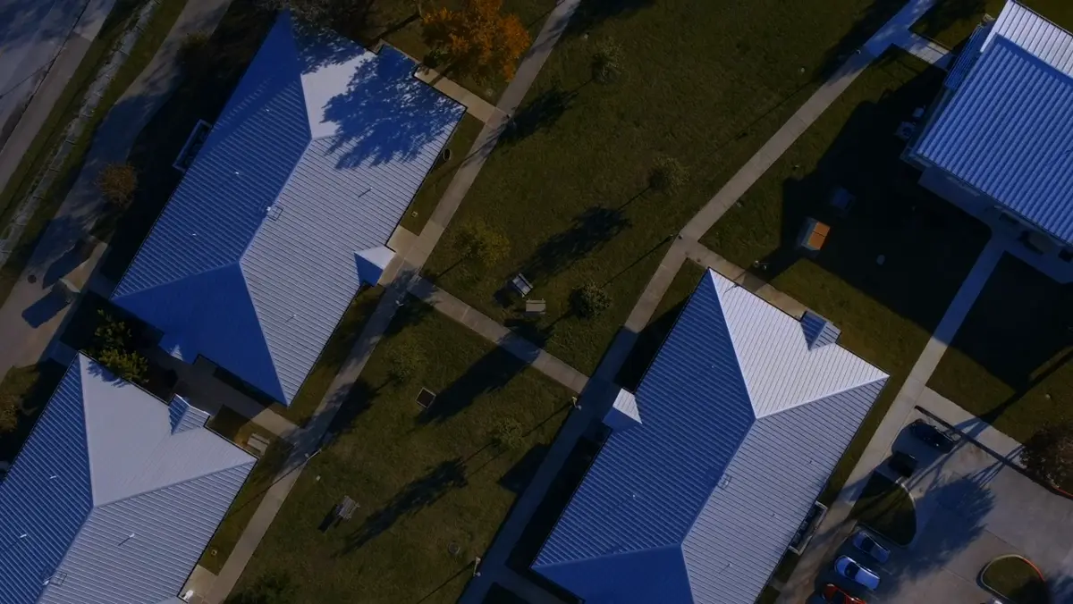 Aerial view of suburban homes, lawns and streets